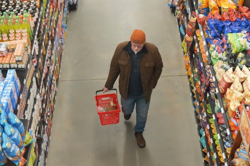 A customer shops at Vince’s Market, a grocery store in Sharon, Ont., on Thursday Nov. 21, 2024. Food inflation figures for January spiked as last year's federal sales tax holiday skewed the comparison to current prices. THE CANADIAN PRESS/Chris Young