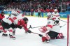 Canada's Marie-Philip Poulin (29) scores past Switzerland's Andrea Braendli (20) during second period women's Olympic semifinal hockey action at the 2026 Milan Cortina Winter Olympics in Milan, Monday, Feb. 16, 2026. THE CANADIAN PRESS/Nathan Denette