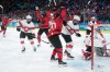 Canada's Marie-Philip Poulin (29) and teammates celebrate her goal against Switzerland's Andrea Braendli (20) during second period women's Olympic semifinal hockey action at the 2026 Milan Cortina Winter Olympics in Milan, Monday, Feb. 16, 2026. THE CANADIAN PRESS/Nathan Denette