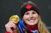 Canada's Megan Oldham shows off her gold medal following the women's free ski big air final at the Milano Cortina 2026 Winter Olympic Games in Livigno, Italy, Monday, Feb. 16, 2026. THE CANADIAN PRESS/Sean Kilpatrick