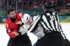 Canadian forward Tom Wilson (43) fights French defenceman Pierre Crinon at the Winter Olympics in Milan on Sunday, Feb. 15, 2026. THE CANADIAN PRESS/Nathan Denette