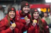 Canada's Ivanie Blondin, Isabelle Weidemann, centre, and Valerie Maltais, right, celebrate holding their gold medals on the podium after the final of the women's team pursuit speedskating race at the 2026 Winter Olympics, in Milan, Italy, Tuesday, Feb. 17, 2026.THE CANADIAN PRESS/Nathan Denette