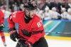 Canada's Sidney Crosby (87) reacts after scoring during a preliminary round game of men's ice hockey between Canada and France at the 2026 Winter Olympics, in Milan, Italy, Sunday, Feb. 15, 2026. (AP Photo/Hassan Ammar)