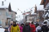 People walk through a street during the 2026 Winter Olympics, in Livigno, Italy, Monday, Feb. 16, 2026. (AP Photo/Andy Bao)