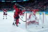 Canada's Connor McDavid (97) and Sam Reinhart (13) celebrate a goal by Canada's Nathan MacKinnon (29) against Czechia goalie Lukas Dostal (1) during the second period of a quarterfinal men's hockey game at the 2026 Winter Olympics, in Milan, on Wednesday, Feb. 18, 2026. THE CANADIAN PRESS/Darryl Dyck