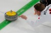 Canada's Marc Kennedy delivers the stone during a men's curling round robin match against China at the 2026 Winter Olympics, in Cortina d'Ampezzo, Italy, Sunday, Feb. 15, 2026. (AP Photo/David J. Phillip)