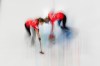 Canada's Emma Miskew, right, and Sarah Wilkes compete against Italy during the women's curling round-robin session at the 2026 Winter Olympics in Cortina d'Ampezzo, Italy on Feb. 18, 2026. (AP Photo/Christophe Ena)