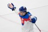 Slovakia's Juraj Slafkovsky celebrates after scoring his side's opening goal during a preliminary round match of men's ice hockey between Sweden and Slovakia at the 2026 Winter Olympics, in Milan, Italy, Saturday, Feb. 14, 2026. (AP Photo/Petr David Josek)
