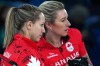 Canada's Rachel Homan and Emma Miskew speak during the women's curling round-robin session against South Korea at the 2026 Winter Olympics in Cortina d'Ampezzo, Italy on Feb. 19, 2026. (AP Photo/Misper Apawu)