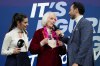 Tenley Albright, 1956 gold medalist at the original Cortina D'Ampezzo Olympics, speaks to interviewers before the women's figure skating free program at the 2026 Winter Olympics, in Milan, Italy, Thursday, Feb. 19, 2026. (AP Photo/Natacha Pisarenko)
