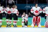 Canada's Emily Clark (26), Emma Maltais (27), Marie-Philip Poulin (29) and goalie Ann-Renee Desbiens (35) react to their 2-1 overtime loss to the United States in the women's gold medal hockey game at the 2026 Winter Olympics, in Milan, Thursday, Feb. 19, 2026. THE CANADIAN PRESS/Darryl Dyck