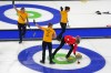 Canada's Rachel Homan, right, competes next to Sweden's Sara McManus. during a women's curling semifinal match against Sweden, at the 2026 Winter Olympics, in Cortina d'Ampezzo, Italy, Friday, Feb. 20, 2026. (AP Photo/Fatima Shbair)