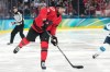 Canada's Shea Theodore (27) is in action during a men's ice hockey semifinal game between Canada and Finland at the 2026 Winter Olympics, in Milan, Italy, Friday, Feb. 20, 2026. (AP Photo/Hassan Ammar)