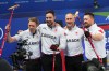 Canada's Brett Gallant, Brad Jacobs, Marc Kennedy, Ben Hebert celebrate after defeating Norway in a men's curling semifinal match at the 2026 Winter Olympics in Cortina d'Ampezzo, Italy on Feb. 19, 2026. (AP Photo/Fatima Shbair)