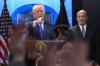 President Donald Trump points to a reporter during a press briefing at the White House on Friday, Feb. 20, 2026, in Washington. Beside the President is Commerce Secretary Howard Lutnik. (AP Photo/Evan Vucci)