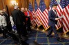 House Speaker Mike Johnson, R-La., reads notes before speaking about the SAVE America Act to reporters on Capitol Hill in Washington, Wednesday, Feb. 11, 2026, in Washington. (AP Photo/Tom Brenner)