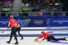 Canada's Rachel Homan, right, competes during a women's curling bronze medal match between Canada and the United States, at the 2026 Winter Olympics, in Cortina d'Ampezzo, Italy, Saturday, Feb. 21, 2026. (AP Photo/Fatima Shbair)