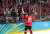 Canadian forward Nathan MacKinnon celebrates his game-winning goal against Finland with the country's fans at the Winter Olympics in Milan on Friday, Feb. 20, 2026. THE CANADIAN PRESS/Nathan Denette