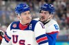 United States' Matthew Tkachuk (19) is challenged by Slovakia's Oliver Okuliar (8) during a men's ice hockey semifinal game between the United States and Slovakia at the 2026 Winter Olympics, in Milan, Italy, Friday, Feb. 20, 2026. (AP Photo/Hassan Ammar)