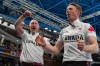 Canada's Brad Jacobs, left, and Marc Kennedy celebrate defeating Britain in a men's curling gold medal match, at the 2026 Winter Olympics, in Cortina d'Ampezzo, Italy, Saturday, Feb. 21, 2026. (AP Photo/Misper Apawu)
