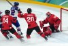 Canadian Jordan Binnington (50) makes a save on American forward Matt Boldy (12) during the third period of the men's gold-medal hockey game at the Winter Olympics in Milan on Sunday, Feb. 22, 2026. THE CANADIAN PRESS/Darryl Dyck