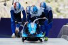 Israel's Adam Edelman, front, Menachem Chen, Uri Zisman and Omer Katz start for a four man bobsled run at the 2026 Winter Olympics, in Cortina d'Ampezzo, Italy, Saturday, Feb. 21, 2026. (AP Photo/Alessandra Tarantino)