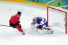 Canada's Connor McDavid (97) is stopped by United States goalie Connor Hellebuyck (37) during the second period of the men's gold medal hockey game at the 2026 Winter Olympics, in Milan, on Sunday, Feb. 22, 2026. THE CANADIAN PRESS/Darryl Dyck