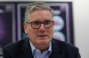 British Prime Minister Sir Keir Starmer speaks with students and staff, during a visit to the Walbottle Academy Campus in Newcastle-upon-Tyne, England, Thursday, Feb. 26, 2026. (Scott Heppell/PA via AP)