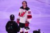 New Jersey Devils' Jack Hughes is honoured along with other Olympic hockey players present before an NHL hockey game against the Pittsburgh Penguins in Pittsburgh, Thursday, Feb. 26, 2026. (AP Photo/Gene J. Puskar)
