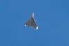 FILE - An Iranian Shahed exploding drone launched by Russia flies through the sky seconds before it struck buildings in Kyiv, Ukraine, on Oct. 17, 2022. (AP Photo/Efrem Lukatsky, File)