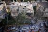 Officers from Israel's Home Front Command inspect a damaged apartment building after an Iranian missile strike in Ramat Gan, Israel, Tuesday, March 3, 2026. (AP Photo/Ohad Zwigenberg)