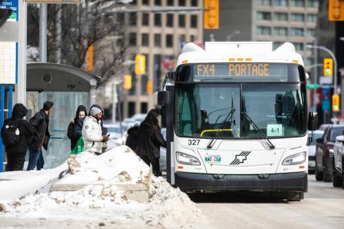 MIKAELA MACKENZIE / FREE PRESS
                                Buses run downtown on Wednesday, Feb. 25, 2026. The Downtown Winnipeg BIZ commissioned a survey, which found that the vast majority of downtown bus riders are unhappy with the new system. For Gabby story. Free Press 2026