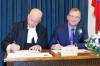 Opposition house leader Derek Johnson, right.