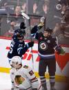 THE CANADIAN PRESS/Fred Greenslade
                                Winnipeg Jets&rsquo; Mark Scheifele celebrates his game-winning goal against the Chicago Blackhawks with Cole Perfetti during the overtime period in Winnipeg, Tuesday.